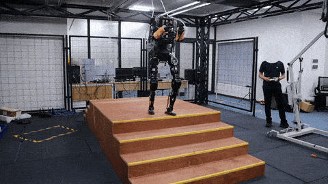 Humanoid descending stairs under a 20 kg rear-mounted backpack